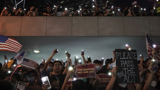 Protestors light their torches during a peaceful rally in central Hong Kong's business district, Oct. 14, 2019.