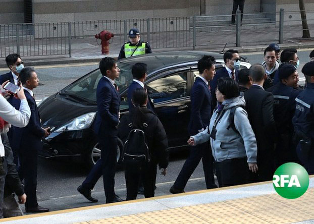 Hong Kong police officers accused of beating a pro-democracy demonstrator arrive at court to hear their verdict. Feb. 14, 2017.