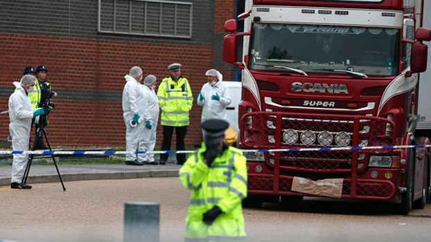 Police investigate a parked truck in an industrial zone in Grays, east of London, where the bodies of 39 suspected human-trafficking victims were discovered, Oct. 23, 2019.