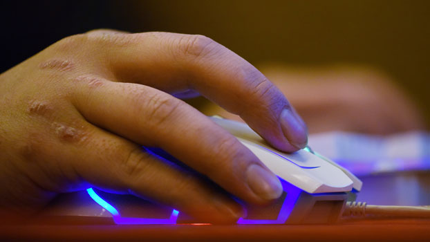 A man uses a computer in an internet cafe in Beijing on the day that China implemented a controversial cybersecurity law, June 1, 2017.