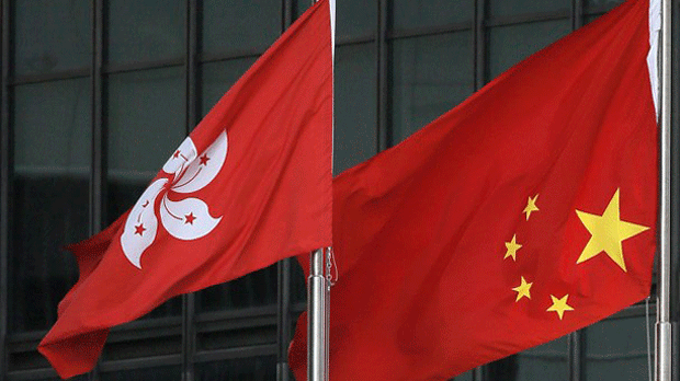 The Chinese national flag (R) is shown flying upside down next to the Hong Kong flag in an undated photo.