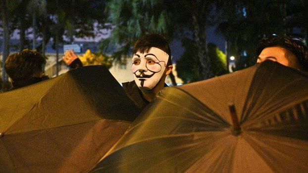A protester wearing a mask takes part in a protest Hong Kong after the government announced a ban on facemasks, Oct. 4, 2019.