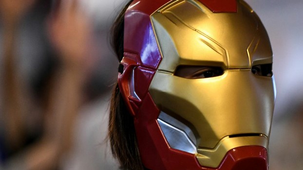 A protester looks on while wearing an 'Iron Man' mask at Admiralty area in Hong Kong as people hit the streets after the government announced a ban on facemasks under colonial-era emergency powers, Oct. 4, 2019. 