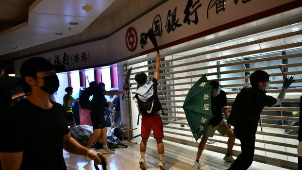Hong Kong protesters smash up a branch of the Bank of China in the Tseung Kwan O residential neighborhood of Kowloon, Oct. 7, 2019.