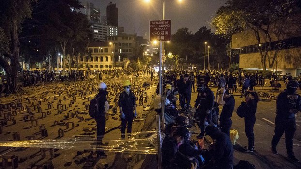 Protesters gather on a blocked road at the Hong Kong Polytechnic University, Nov. 14, 2019.