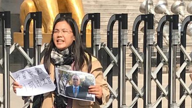Xu Yan, wife of detained attorney Yu Wensheng, calls for his release outside a court in Xuzhou, a city in the eastern Chinese province of Jiangsu, Oct. 31, 2019.