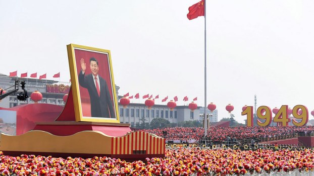 A float with a giant portrait of China's President Xi Jinping passes by Tiananmen Square during the National Day parade in Beijing to mark the 70th anniversary of the founding of the People's Republic of China, Oct. 1, 2019.