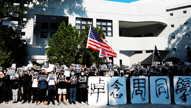 Hong Kong university students mourn the death of a classmate who died after a fall many blame on the police, Nov. 8, 2019.