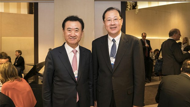 Ren Xuefeng (R), deputy Communist Party secretary of the southwestern Chinese megacity of Chongqing, in photo taken with Wang Jianlin, founder of Dalian Wanda Group, at Davos, Jan. 17, 2017. 