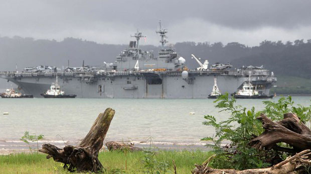 The USS Boxer, an American navy ship, arrives at Subic Bay, northern Philippines, ahead of a bilateral military exercise with Filipino troops, Sept. 16, 2013.