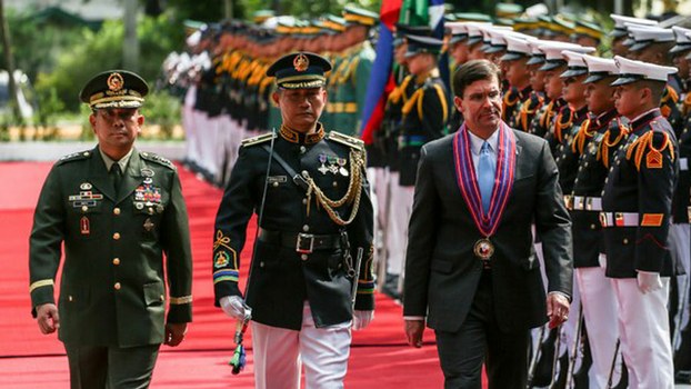 U.S. Secretary of Defense Mark Esper reviews an honor guard during his visit to the Philippine Department of National Defense in Manila, Nov. 19, 2019.