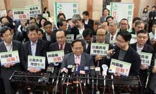Albert Ho (C) speaks near the Registration and Electoral Office in Hong Kong, Feb. 14, 2012.
