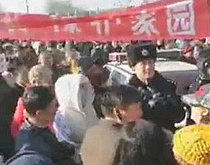 Thousands of Chinese residents protest against a plan to build an aluminum plant near their home in Daqing, northeastern China's Heilongjiang province, Feb. 14, 2017.