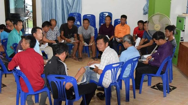 A group of Lao citizens discussing plans to stage a protest in the capital Vientiane before police came and detained some of them, Nov. 12, 2019. 