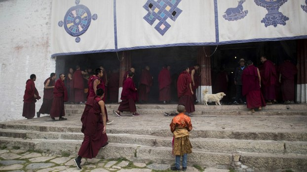 Monks enter the Buddhist Sera monastery in the regional capital Lhasa, in China's Tibet Autonomous Region, in file photo.