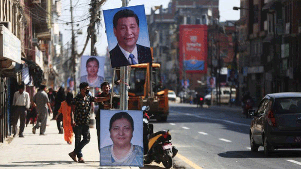 Pictures of China's president Xi Jinping and Nepal's president Bidhya Devi Bhandari line a street in Kathmandu during Xi's state visit to Nepal, Oct. 12-13, 2019.